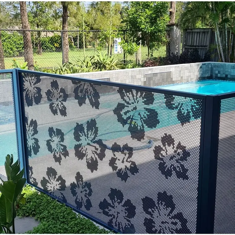 A Deep Ocean blue PoolPerf panel with the Hibiscus flower design on the corner of a raised pool