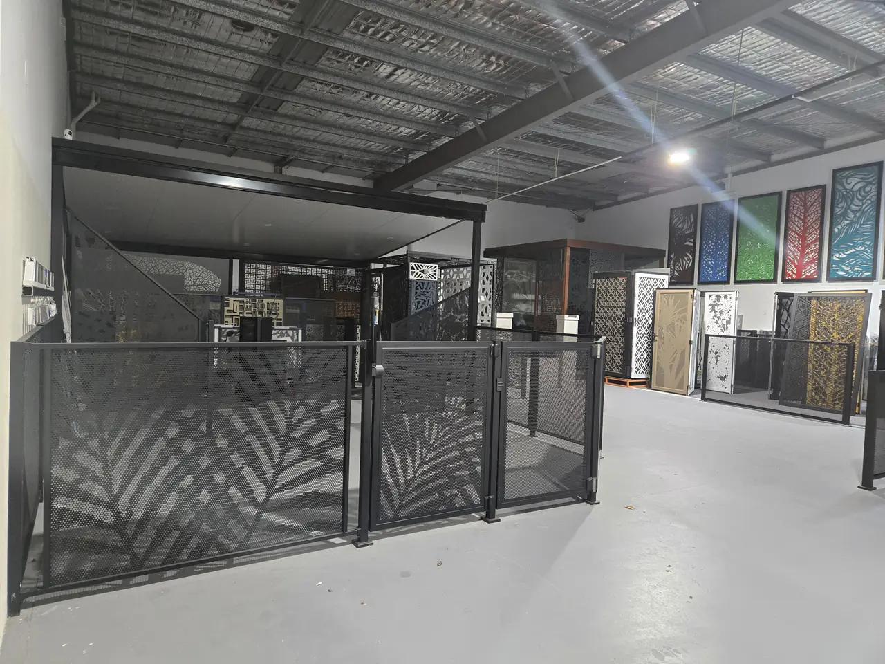 Inside the Decoview showroom on the Gold Coast: PoolPerf panels and gates set up to walk around, with decorative screens along the wall